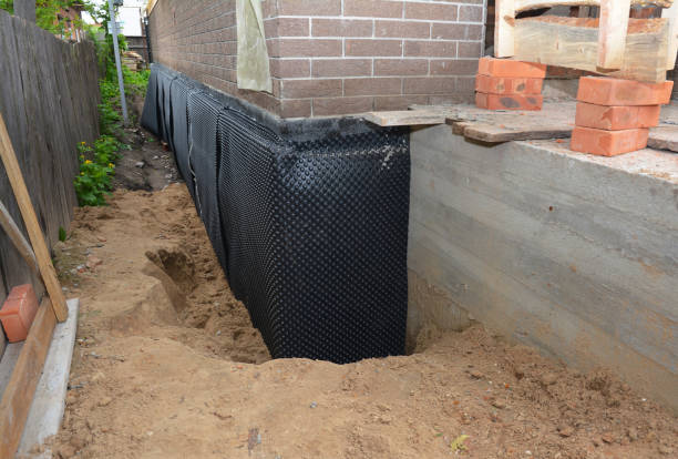 SJ Waterproofing Pros technician performing targeted Basement Waterproofing assessment in Chesterville, OH